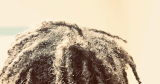 Short locs seen from above, showing the parts and the scalp between them